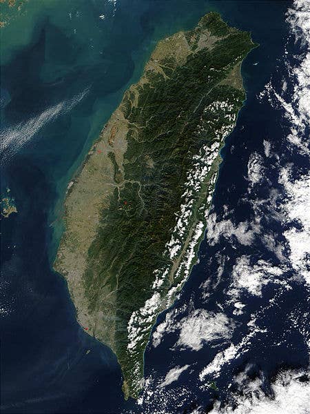 Satellite photo of Taiwan/NASA. "The island of <a href="https://commons.wikimedia.org/wiki/Taiwan">Taiwan</a> sits off of the coast of southern China between the East China Sea, the South China Sea, southwestern Japan's Nansei-shoto Islands, and the <a href="https://commons.wikimedia.org/wiki/Pacific_Ocean">Pacific Ocean</a>.