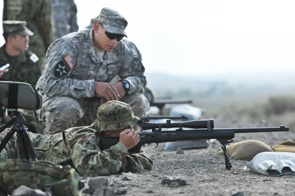 <em>American and Japanese snipers train on the M24 rifle, the Army's version of the Remington Model 700 (U.S. Army)</em>