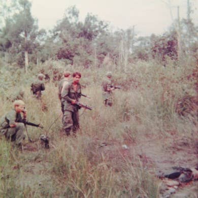 <em>Blue Spaders radio a sitrep after an ambush during a battalion saturation campaign in Vietnam (U.S. Army)</em>