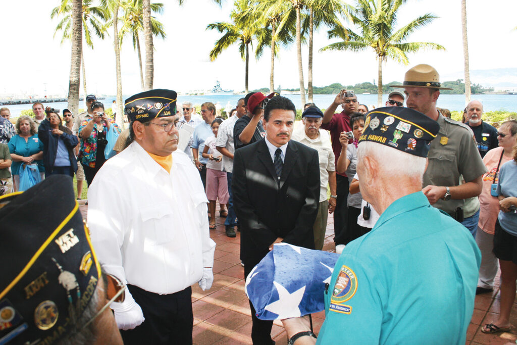 <em>A Pearl Harbor survivor presents the USS </em>Arizona<em> Memorial flag to American Legion members of the Salt River Indian Community (Salt River Pima-Maricopa Indian Community)</em>