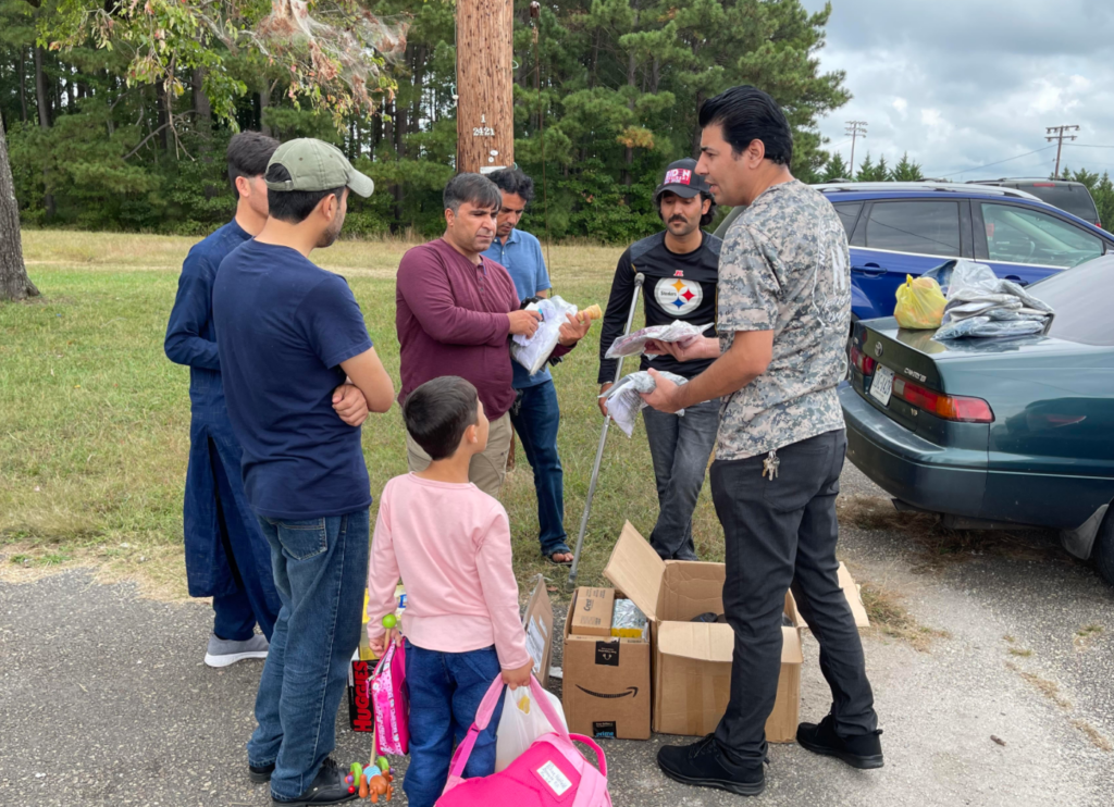 Janis hands out life-sustaining supplies to SIV refugees at Fort Pickett in Virginia, November 2021.