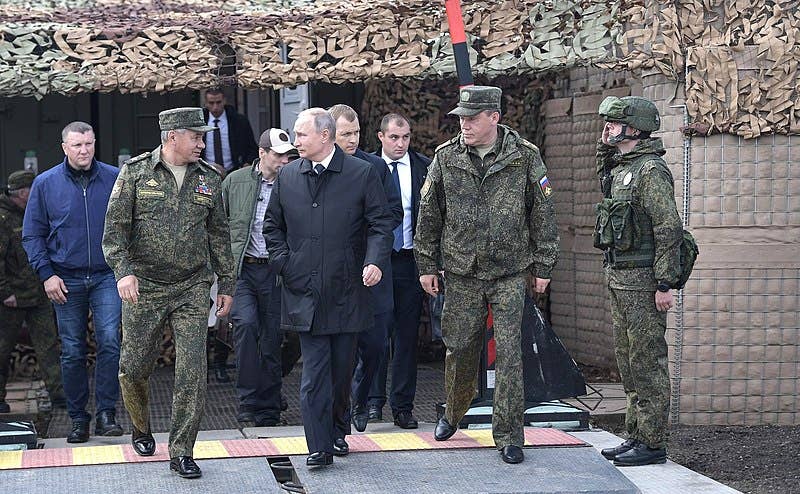 Russian President <a href="https://en.wikipedia.org/wiki/Vladimir_Putin">Vladimir Putin</a> (center) meeting with Russian Defense Minister <a href="https://en.wikipedia.org/wiki/Sergey_Shoygu">Sergey Shoygu</a> (left) and Chief of the General Staff <a href="https://en.wikipedia.org/wiki/Valery_Gerasimov">Valery Gerasimov</a> (right) at the <a href="https://en.wikipedia.org/wiki/Vostok_2018">Vostok 2018</a> drills.
