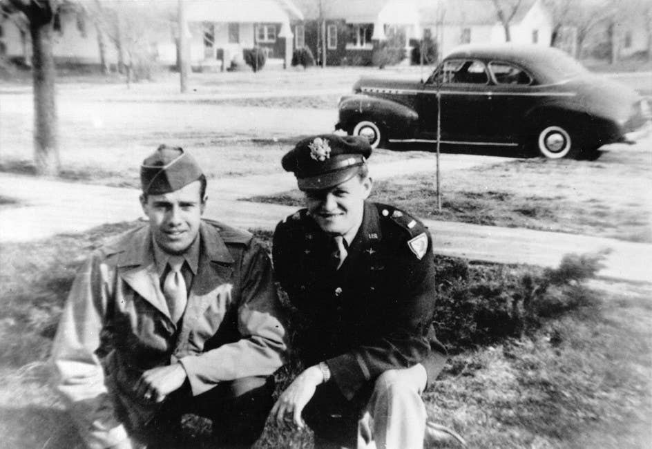 <em>Dole (left) with his childhood friend, Bub Dawson, in 1944 (U.S. Army)</em>
