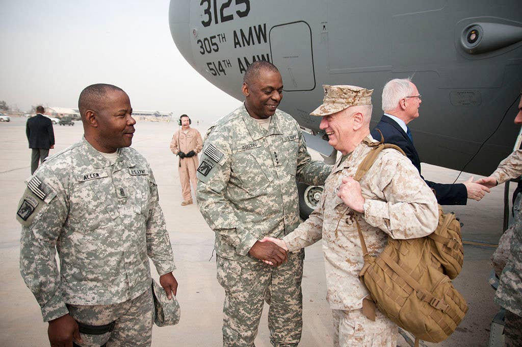 Gen. Lloyd J. Austin III, commander, United States Forces-Iraq, and Command Sgt. Maj. Joseph R. Allen greet Gen. James N. Mattis, commander of United States Central Command, as he arrives in Baghdad for the end of mission ceremony. (U.S. Army photo)