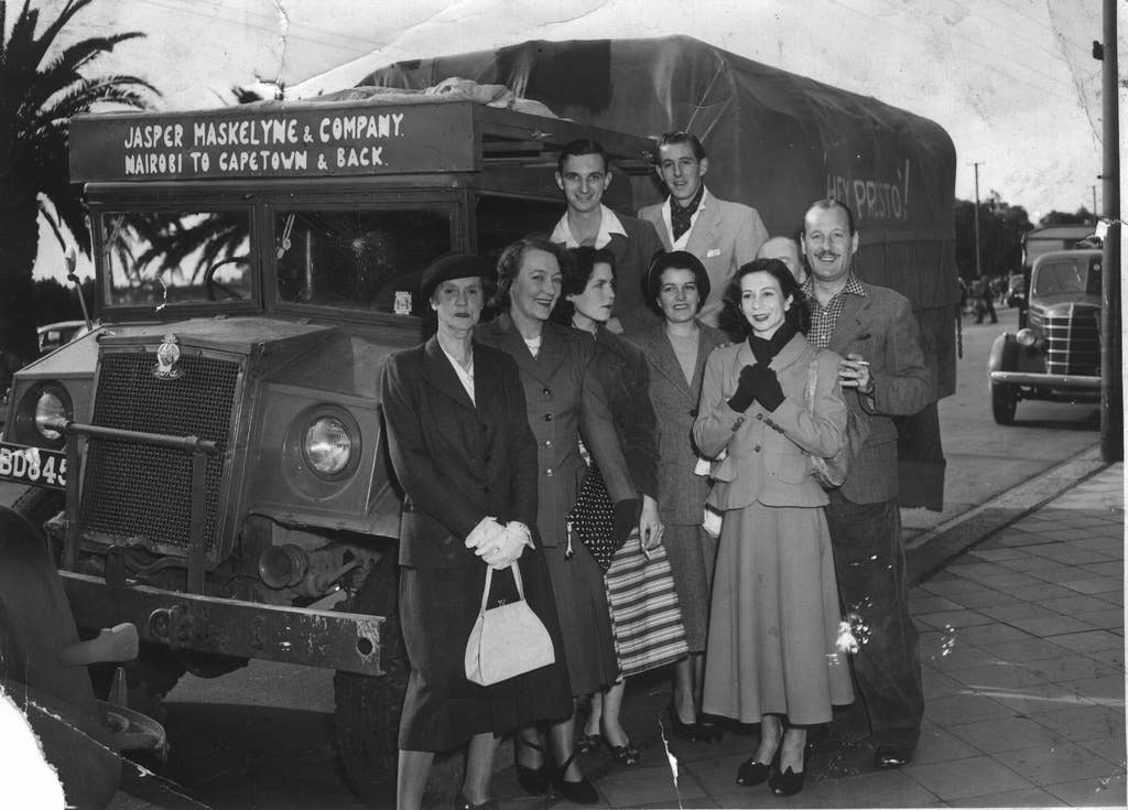 Jasper Maskelyne and his magic troupe departing from Nairobi in 1950. Jasper Maskelyne is on the right, touching the arm of Yvonne Helliwell, his stage assistant. (Wikimedia Commons)