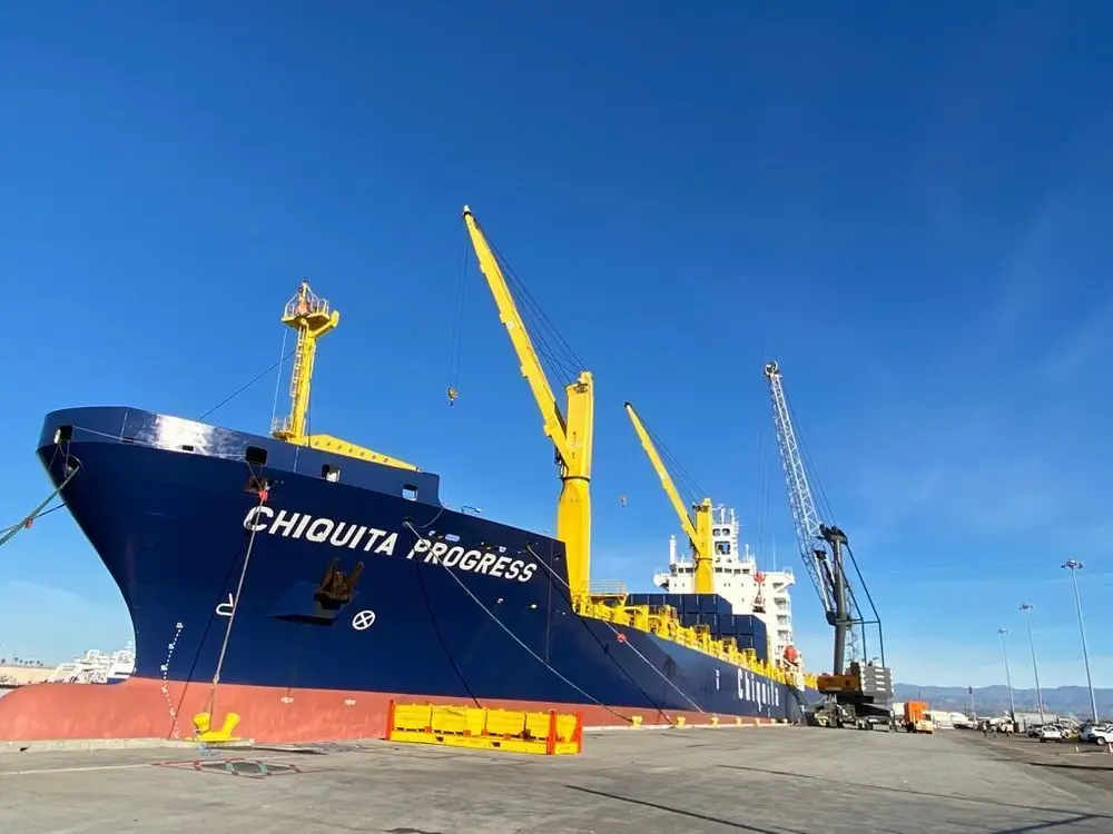 <em>A cargo ship unloads commercial goods at Port Hueneme (U.S. Navy)</em>