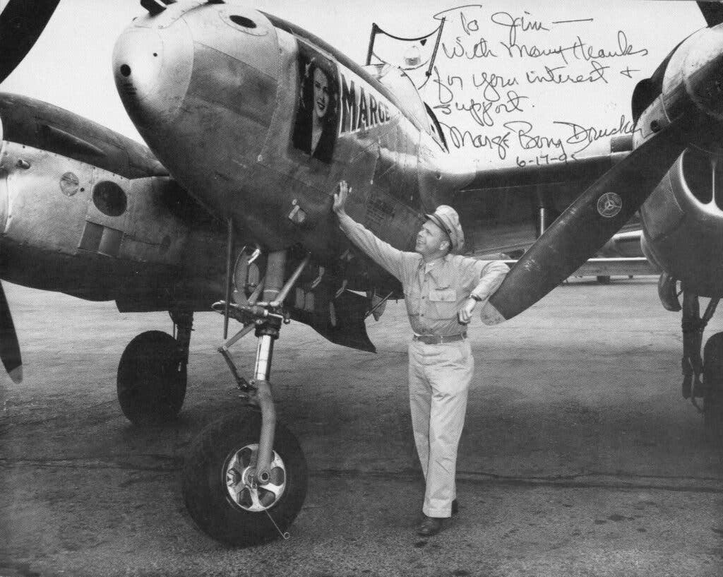 <em>A signed photo of Bong with his P-38 named Marge (Public Domain)</em>