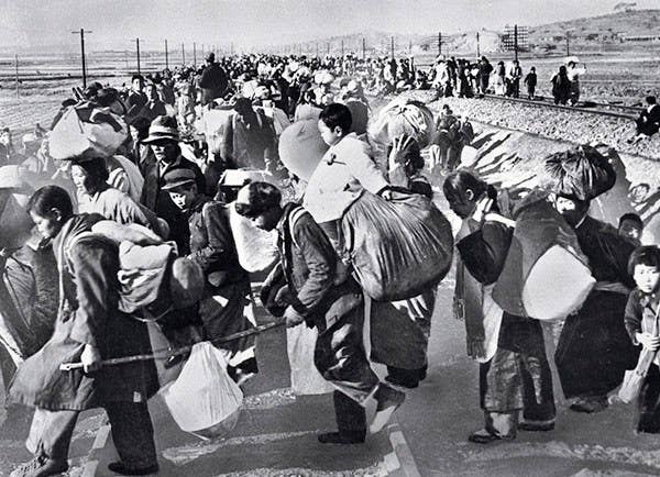Hundreds of thousands of Koreans fled south in mid-1950 after the North Korean army struck across the border. Rumors spread among U.S. troops that the refugee columns harbored North Korean infiltrators. (U.S. Defense Department)