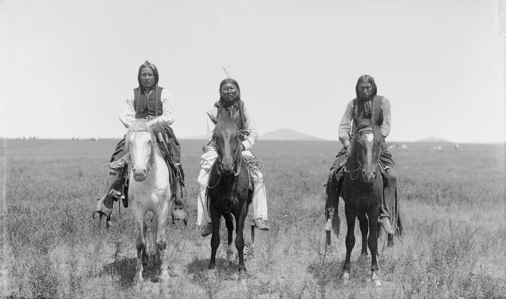 Three mounted Comanche warriors, left, Frank Moetah. Photo by James Mooney, 1892.
