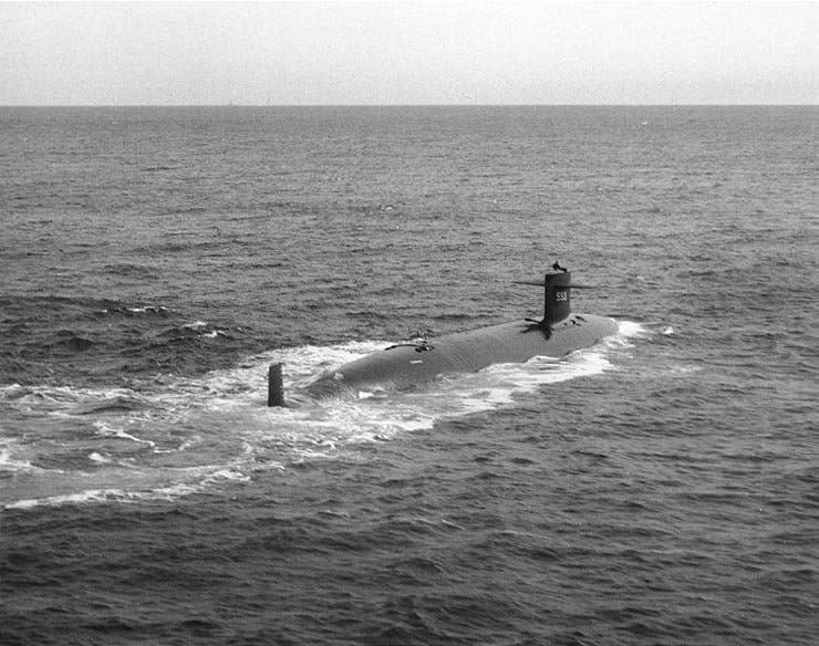 USS Thresher (SSN-593), starboard quarter view, taken while the submarine was underway on 30 April 1961. (Naval Historical Center)
