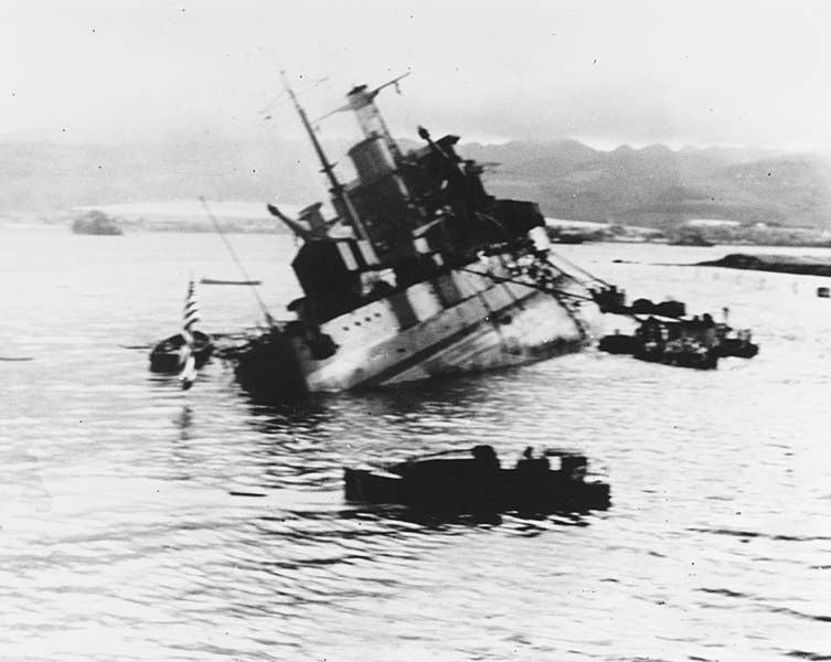 <em>Utah</em> capsizing during the <a href="https://en.wikipedia.org/wiki/Attack_on_Pearl_Harbor">attack on Pearl Harbor</a>.