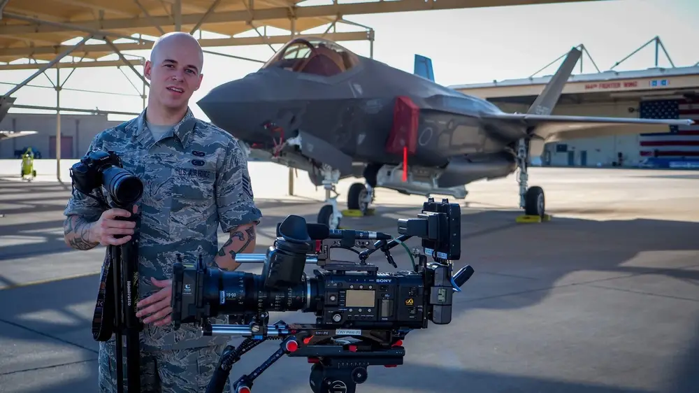 Staff Sgt. Corban Lundborg, 4th Combat Camera Squadron combat photojournalist, prepares the cameras before a video production shoot for the Air Force Reserve mission video Aug. 7, 2017, at Luke Air Force Base, Ariz. A small team from the 4th Combat Camera Squadron, were assigned to create a mission video for the Air Force Reserve. Lundborg is an entrepreneur who took the camera skills learned through the Air Force and with his wife started a media production company. (U.S. Air Force photo by Staff Sgt. Corban Lundborg)