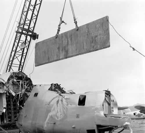 <em>A B-24 Liberator is cut up for scrap at Storage Depot No. 41 (Public Domain)</em>