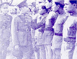<a href="https://en.wikipedia.org/wiki/Plaek_Phibunsongkhram">Plaek Phibunsongkhram</a> inspecting troops during the war. (Public domain)