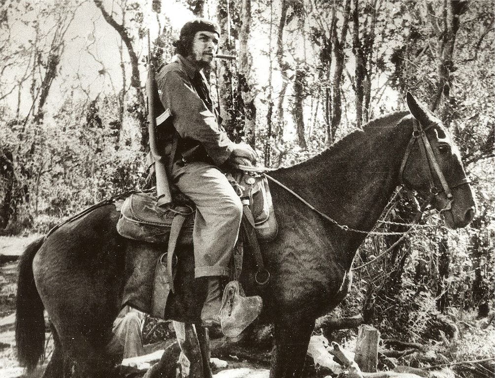 Guevara with a Cristóbal Carbine on a mule in Las Villas province, Cuba, November 1958.