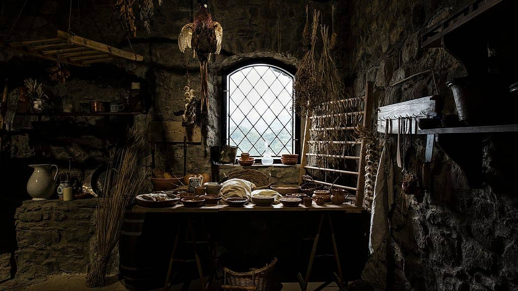 A restored medieval kitchen inside Verrucole Castle, Tuscany.