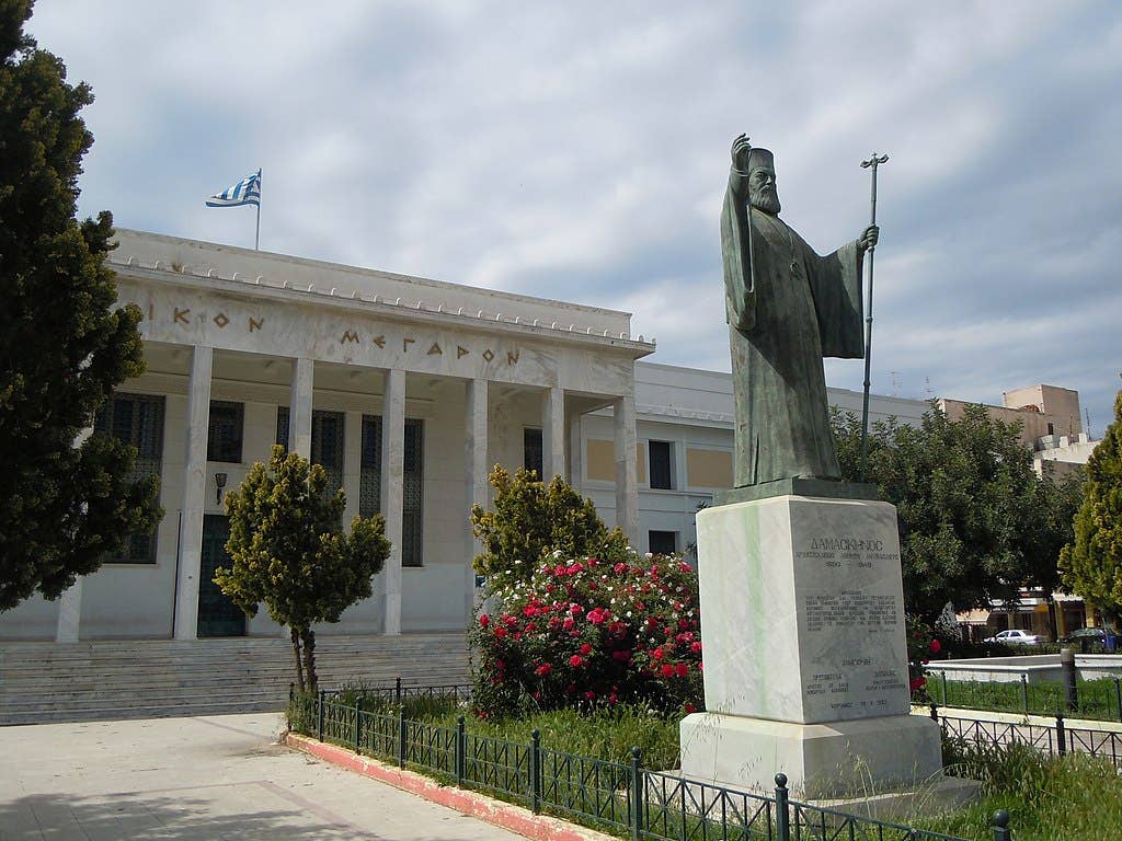 A statue of Archbishop Damaskinos in <a href="https://en.wikipedia.org/wiki/Corinth">Corinth</a>. (Wikimedia Commons)<br><br>