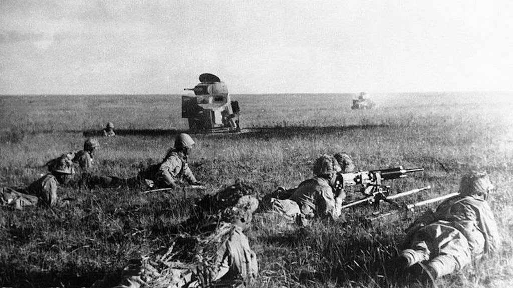 Japanese infantrymen near wrecked USSR armored vehicles, July 1939.