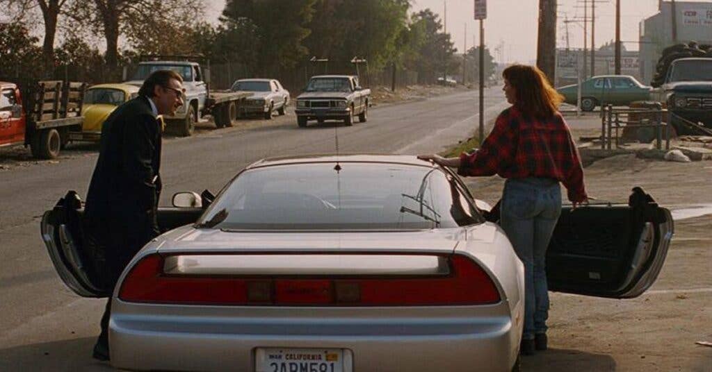 Keitel (left) with his NSX as The Wolf. Photo courtesy of https://www.hotcars.com/the-acura-nsx-was-the-real-hero-of-pulp-fiction/