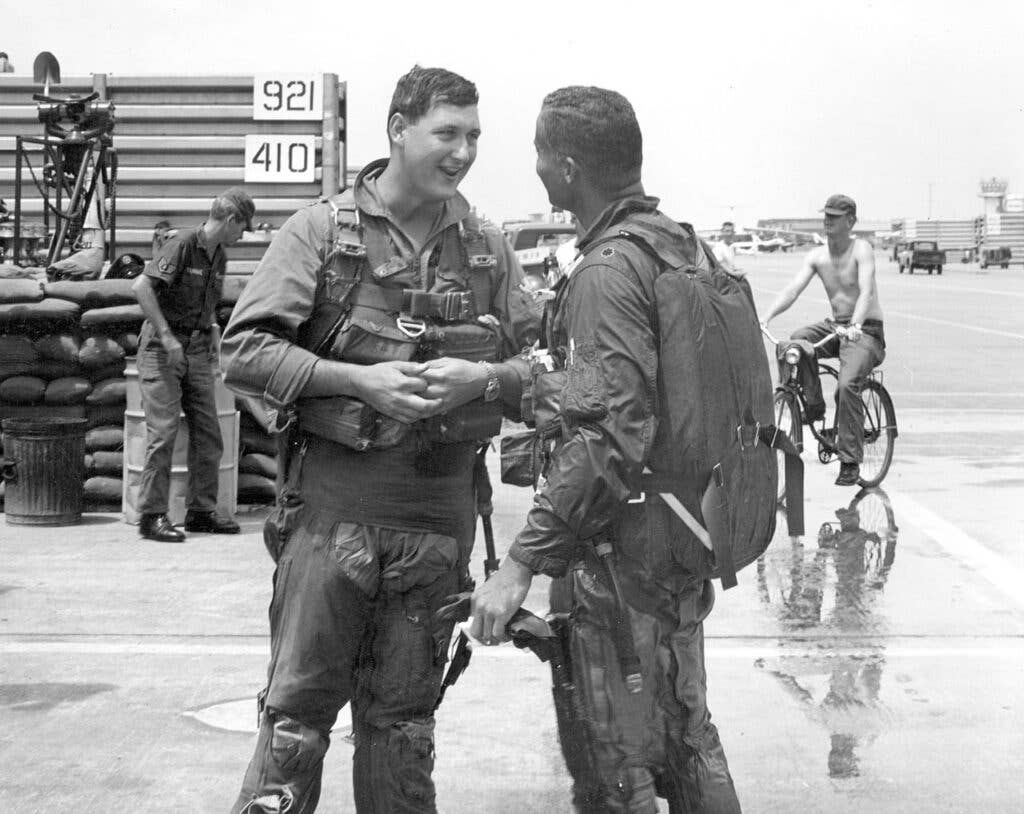 <em>McGee (right) with his backseater Lt. Tom Coney (left) (U.S. Air Force)</em>