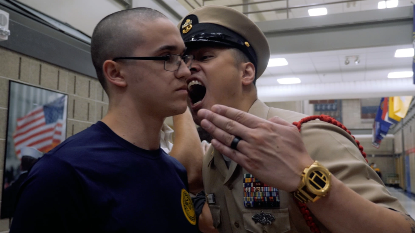 Chief Hospital Corpsman Jaime Kalaw, a recruit division commander at Recruit Training Command Great Lakes, disciplines a new recruit during "Night of Arrival" at the Navy's only Boot Camp. (U.S. Navy photo by Austin Rooney/Released)