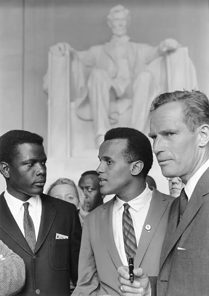 <em>Poitier (left) during the 1963 March on Washington with Harry Belafonte and Charlton Heston (Public Domain)</em>