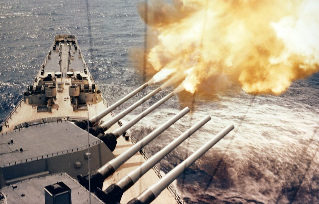 <em>USS </em>Wisconsin<em> shells communist targets during the Korean War (U.S. Navy)</em>