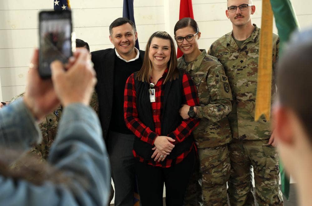 Specialists Brianna Hunter, John Parish (pictured) Abigail Potts, and David Barbeau Jr.,(blocked by phone) of the 438th Military Police Company, pose for photos after the departure ceremony held in Murray, Ky., prior to their departure for their deployment to Kosovo Jan. 5, 2022. (U.S. Army National Guard photo by Sgt. 1st Class Benjamin Crane)<br>Photo by&nbsp;<a href="https://www.dvidshub.net/portfolio/1672918/andrew-dickson">Staff Sgt. Andrew Dickson</a>, <a href="https://www.dvidshub.net/unit/PAO-KNG">Kentucky National Guard Public Affairs Office</a>&nbsp;&nbsp;