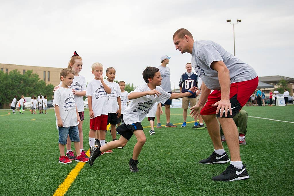 Rob Gronkowski, New England Patriots tight end, runs football drills with participants of a ProCamps event on Joint Base Andrews, Md., July 2, 2015. Gronkowski, a three-time Pro Bowler and Super Bowl XLIX champion, coached approximately 100 military children during the two-day football camp. (U.S. Air Force photo/Tech. Sgt. Robert Cloys)