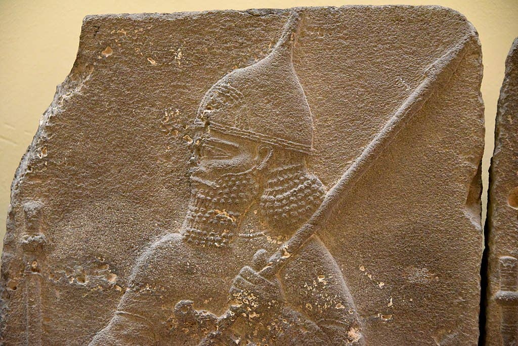 Assyrian soldier holding a long spear and wearing a helmet. Detail of a basalt relief from the palace of Tiglath-pileser III at Hadatu (modern-day Arslan Tash), Syria. Neo-Assyrian Period, 744-727 BCE. Ancient Orient Museum, Istanbul.