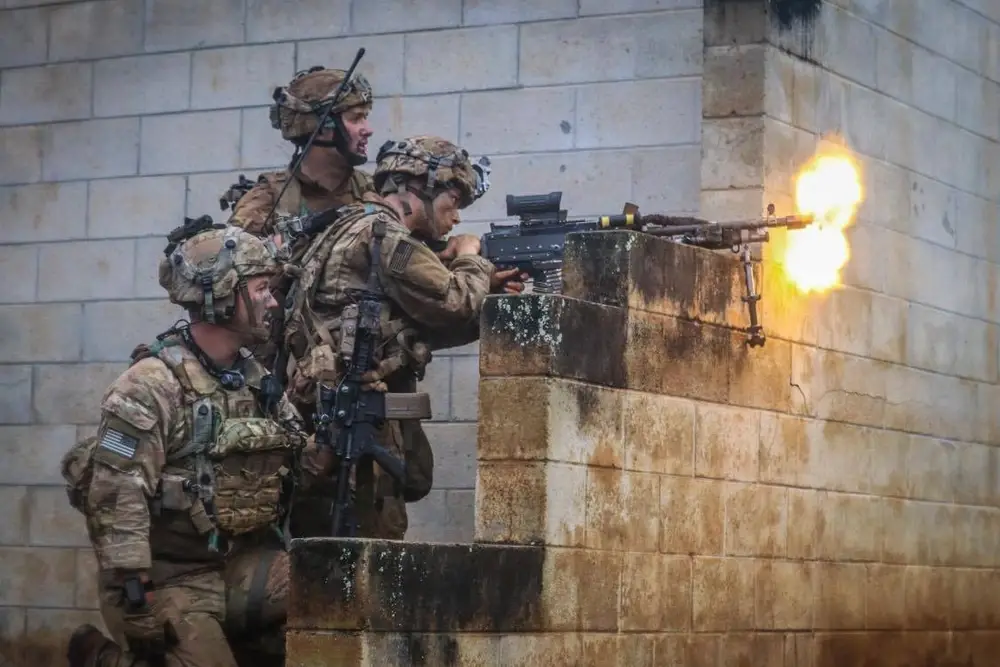 <em>An M240L gun team provides suppressing fire during an exercise (U.S. Army)</em>