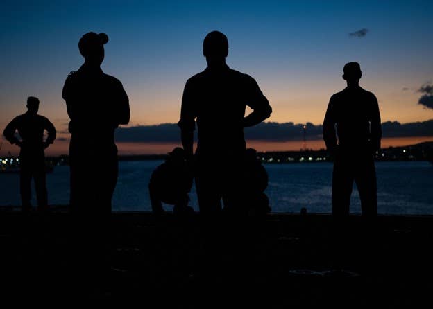 PEARL HARBOR, HI, 02.21.2022<br>Photo by Petty Officer 2nd Class Wesley Richardson, USS Essex-LHD 2<br>JOINT BASE PEARL HARBOR-HICKAM (Feb. 21, 2022) Sailors assigned to Wasp-class amphibious assault ship USS Essex (LHD 2) and Marines assigned to 11th Marine Expeditionary Unit (MEU) observe as Essex gets underway during a sea and anchor evolution, Feb. 21, 2022. Sailors and Marines of Essex Amphibious Ready Group (ARG) and the 11th MEU are underway conducting routine operations in U.S. 3rd Fleet.
