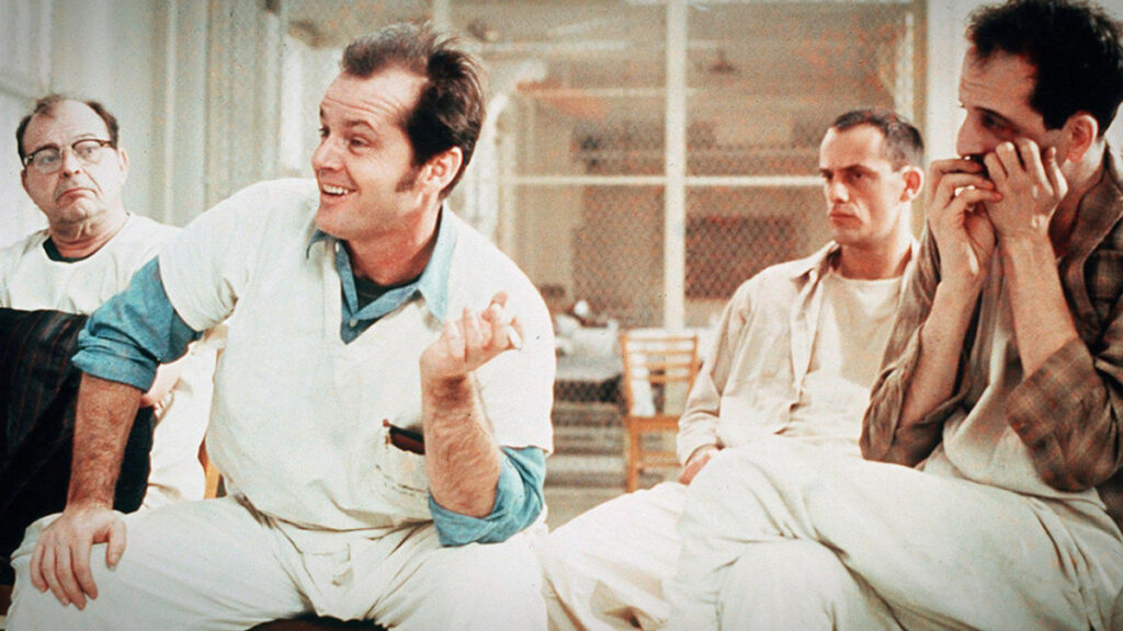 Nicholson (center) as RP McMurphy in <em>One Flew Over the Cuckoo's Nest</em>. Photo courtesy of letterboxd.com.