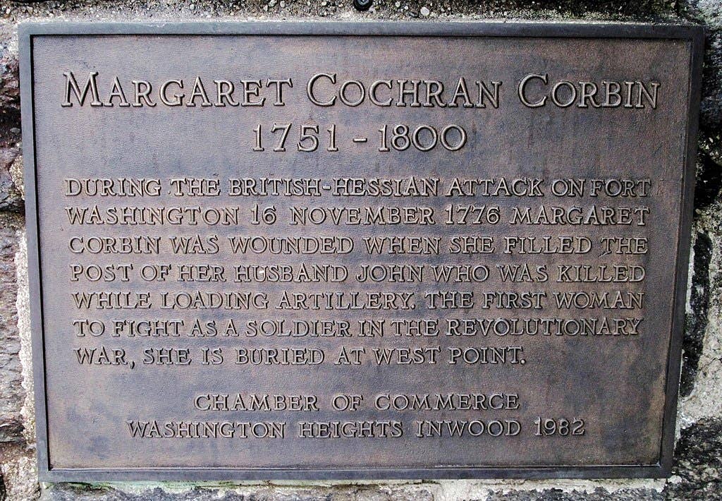 A plaque honoring <strong><a href="https://en.wikipedia.org/wiki/Margaret_Corbin">Margaret Corbin</a></strong>, a heroine of the American Revolutionary War, in Fort Tryon Park, Manhattan, New York City, near the site of the Battle of Fort Washington. The plaque is located on the eastern plynth at the start of Margaret Corbin Drive where it meets Margaret Corbin Circle.