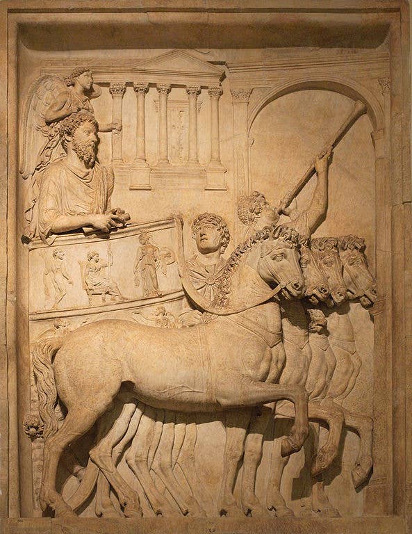 Panel from a representation of a triumph of the Emperor Marcus Aurelius; a winged <em>genius</em> hovers above his head.
