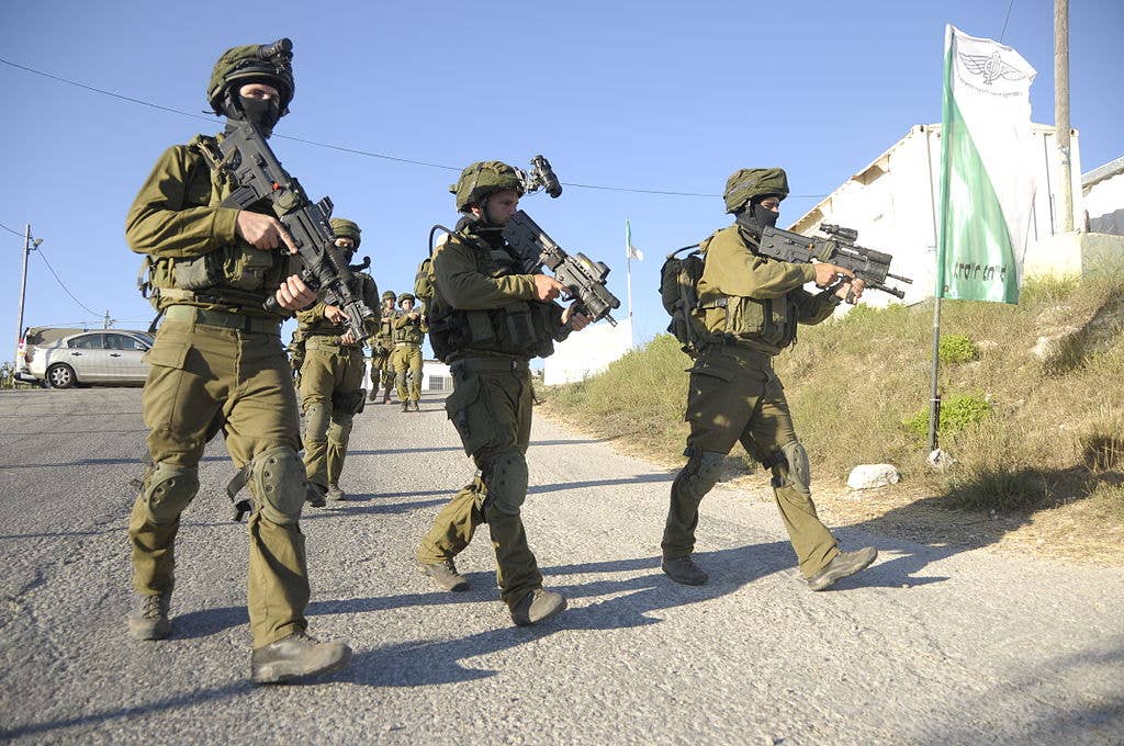 Israeli soldiers during Operation Brothers' Keeper (2014) armed with IWI X95s. (Israel Defense Forces)