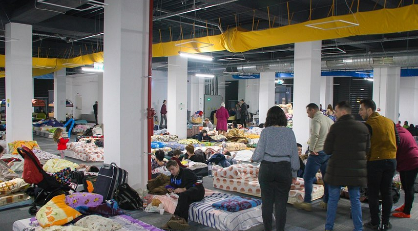 <em>A conference room in Romania converted into a shelter for Ukrainian refugees. WCK prepares meals in the room next door (WCK)</em>