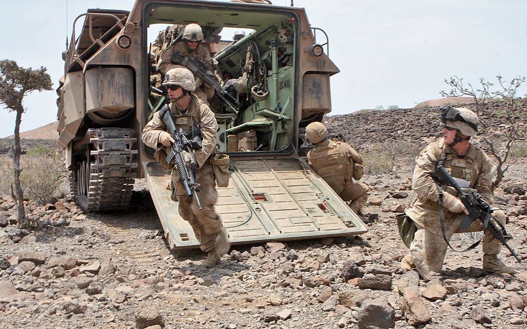 U.S. Marines dismounting from an Assault Amphibious Vehicle in Djibouti. (U.S. Marine Corps photo by Sgt. Alex C. Sauceda)