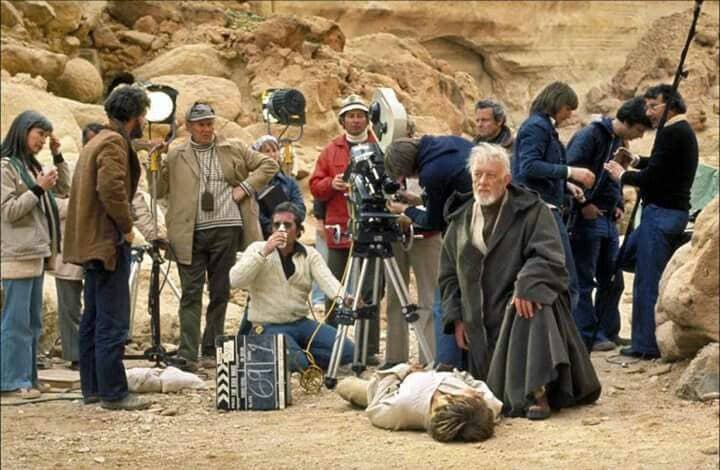 George Lucas on the left in the dark brown jacket and Gilber Taylor with the blue hat and light brown jacket standing next to the lamp. Oh and that's Luke on the ground. Photo courtesy of pinterest.com.
