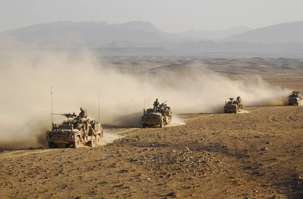 <em>Australian special forces driving Land Rovers in Afghanistan in 2009 (Not 22 SAS during Operation Trent in 2001) (Australia Defence Force)</em>