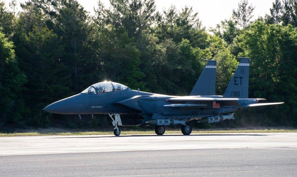 <em>An F-15E Strike Eagle prepares to take off from Eglin Air Force Base for a QUICKSINK test (U.S. Air Force)</em>