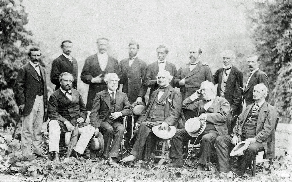 General Lee and his Confederate officers in their first meeting since Appomattox, taken at White Sulphur Springs, West Virginia, in August 1869, where they met to discuss "the orphaned children of the Lost Cause". This is the only from life photograph of Lee with his Generals in existence, during the war or after. Left to right standing: General James Conner, General Martin Witherspoon Gary, General John B. Magruder, General Robert D. Lilley, General P. G. T. Beauregard, General Alexander Lawton, General Henry A. Wise, General Joseph Lancaster Brent Left to right seated: Blacque Bey (Turkish Minister to the United States), General Robert E. Lee, Philanthropist George Peabody, Philanthropist William Wilson Corcoran, James Lyons (Virginia).