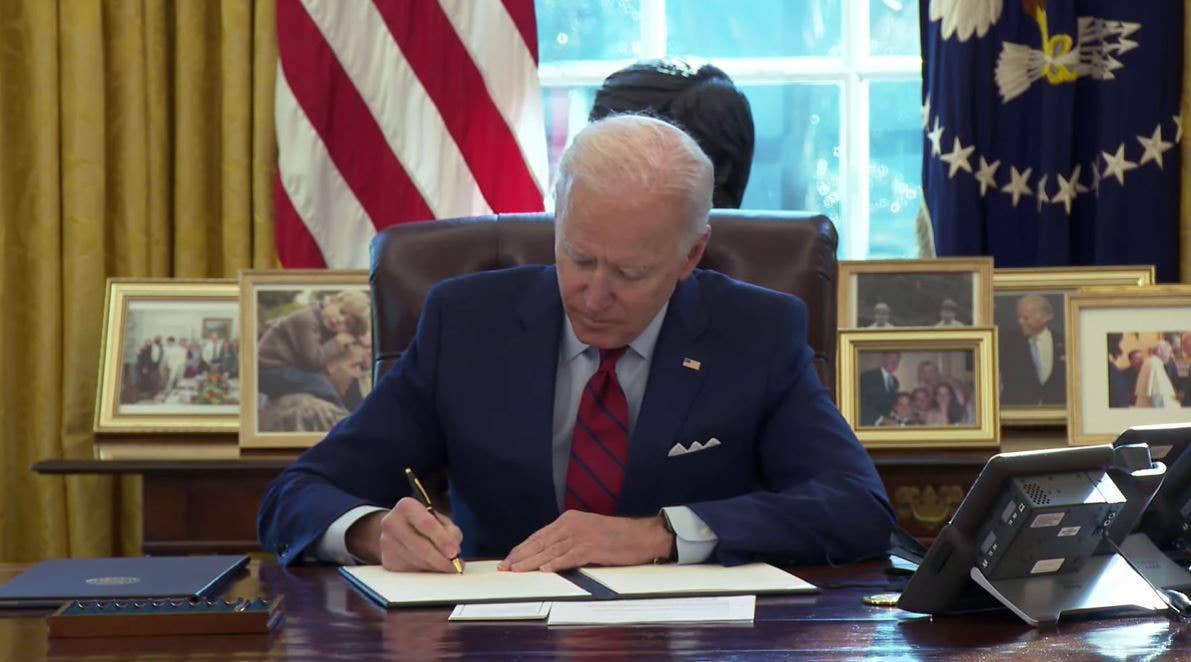 Biden signs an Executive Order at the White House.