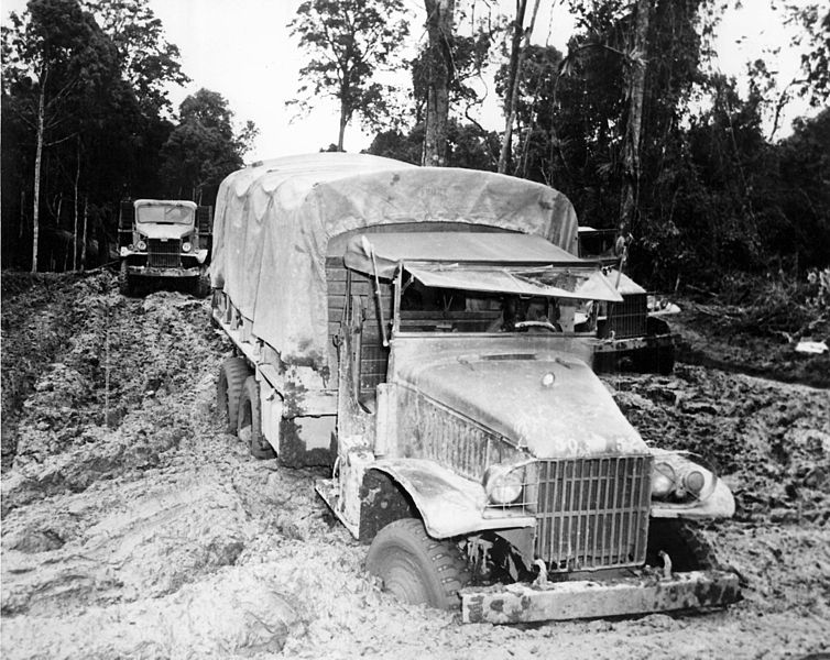 A Red Ball Express truck gets stuck in the mud during World War II, 1944.