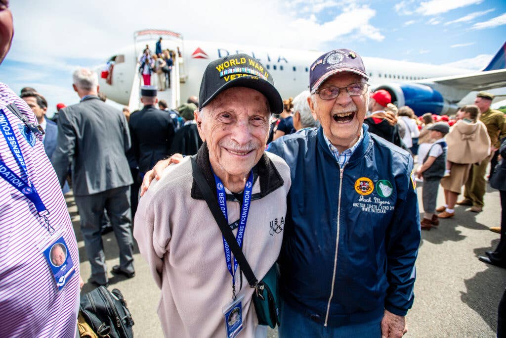 <em>Delta and Michelin employees turned out to send off the WWII vets on their way to France (Delta)</em>