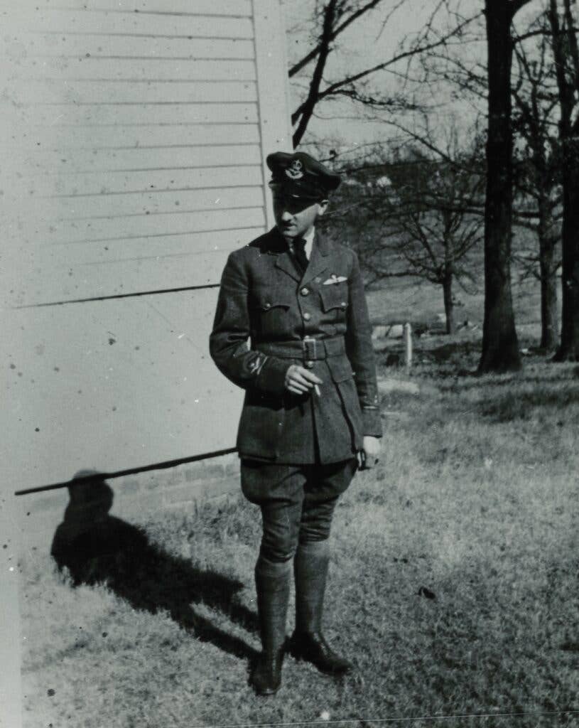 Faulkner in his Royal Canadian Air Force uniform with trademark cigarettes. Photo courtesy of smallnotes.library.virgina.edu.