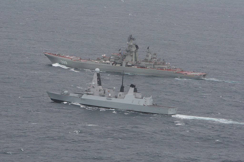 HMS Dragon (foreground) with the Russian Kirov Class battlecruiser 'Pyotr Velikiy'. (Royal Navy)