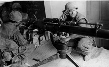 U.S. Marines deploy a <a href="https://en.wikipedia.org/wiki/M40_recoilless_rifle">106&nbsp;mm recoilless rifle</a> from within <a href="https://en.wikipedia.org/wiki/Hu%E1%BA%BF_University">Huế University</a> to target a PAVN machine gun emplacement.