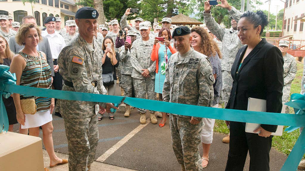 25th Infantry Division Commanding General Maj. Gen. Charles Flynn cuts the ceremonial ribbon during the opening of the SHARP Resource Center on Schofield Barracks Oct. 17. The center will provide SHARP victim advocacy, investigative, legal services for the Army community. (DVIDS)
