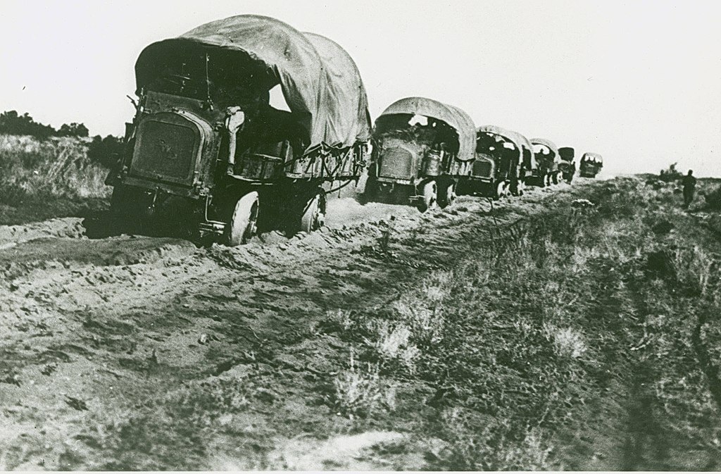A motorized convoy makes its way down a rutted road. (U.S. Army photo)